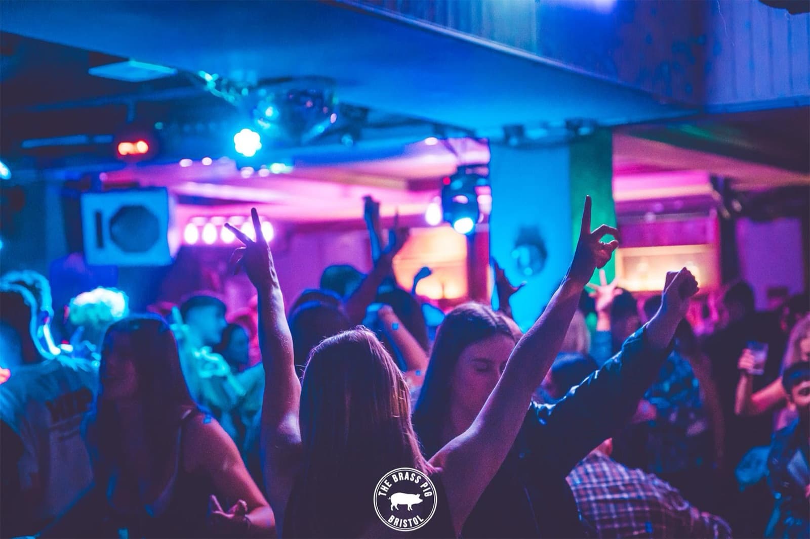 Crowd with hands up dancing at OMP Mondays
