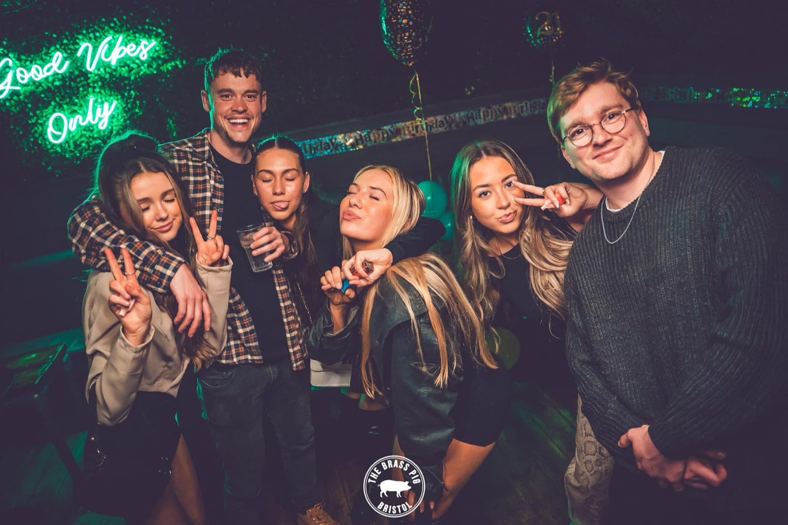 Crowd under neon lights at OMP Mondays